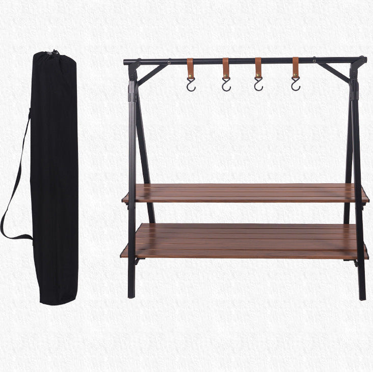 Wooden shelf with metal frame and hooks next to a black mat on a white background